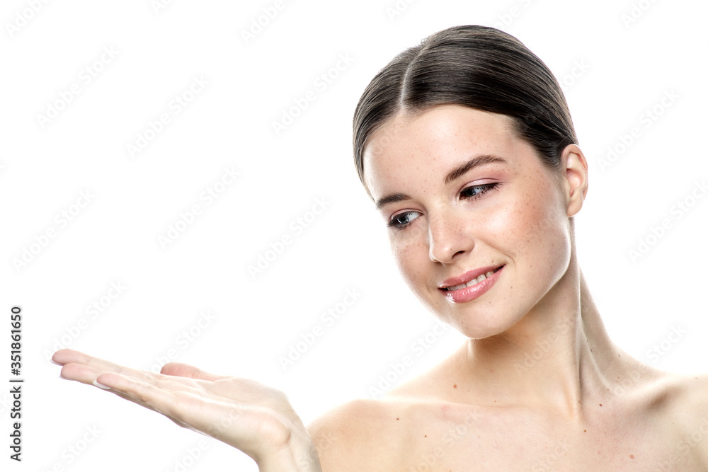 A close-up portrait of a girl with freckles and clear skin. Light blue eyes. The girl has different emotions, she looks at the camera. Isolated on a white background A close-up portrait of a girl with freckles and clear skin. Light blue eyes. The girl has different emotions, she looks at the camera. Isolated on a white background