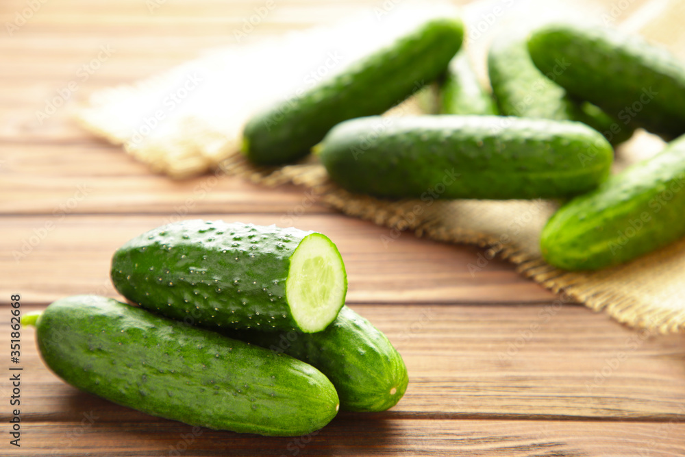 Fresh cucumber slices on brown wooden background. Fresh cucumber slices on brown wooden background.