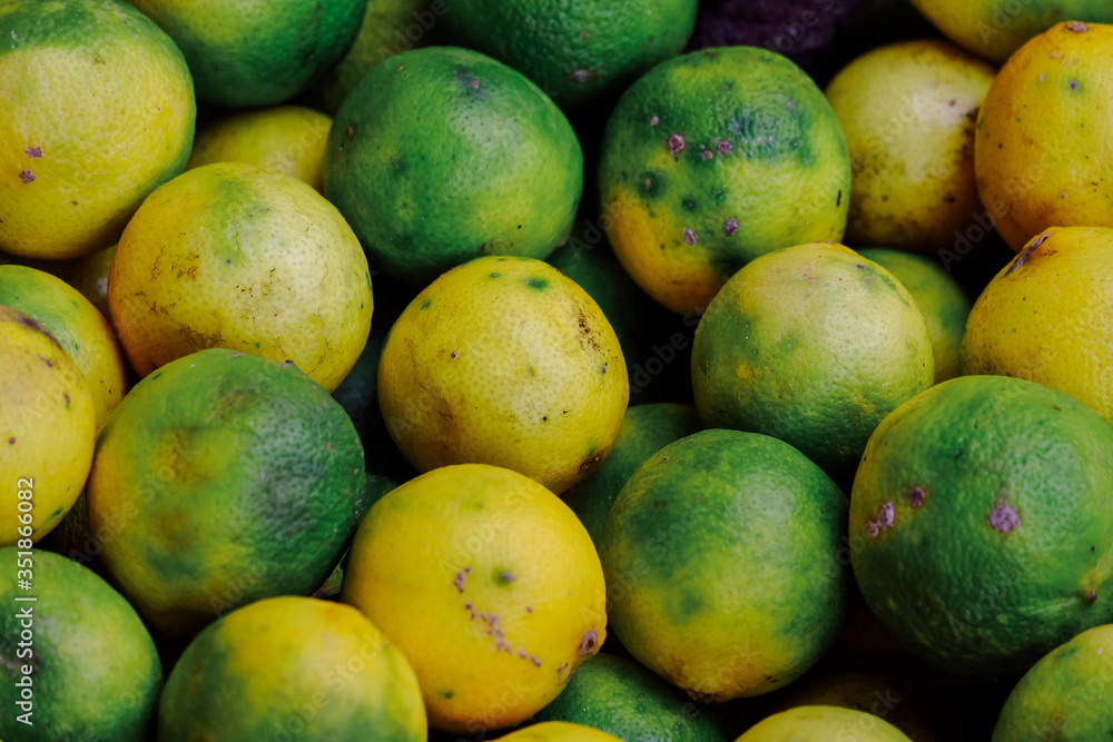 Natural fresh lime. Texture pattern juicy green tropical lime fruit in a supermarket. Royalty high-quality free stock image of citrus fruits. Full frame group of limes. Natural fresh lime. Texture pattern juicy green tropical lime fruit in a supermarket. Royalty high-quality free stock image of citrus fruits. Full frame group of limes.