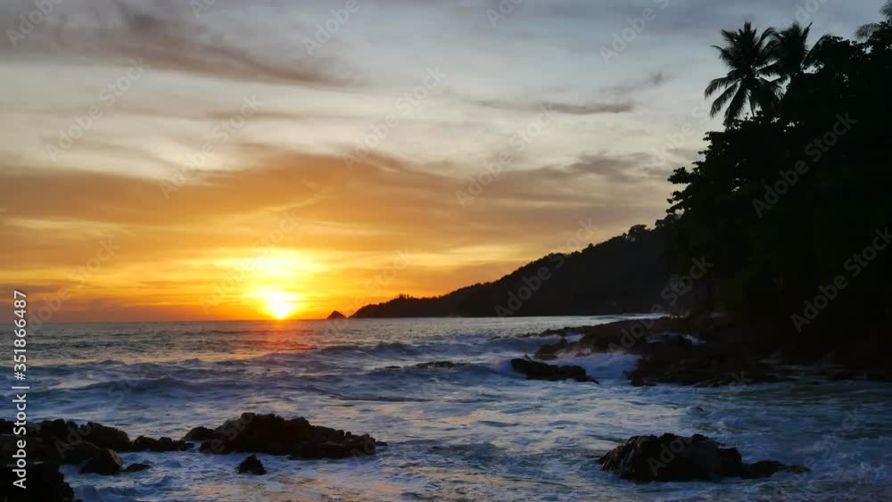 moving sea wave water hit sand and rock beach, horizon skyline mountain long distance, beautiful colorful cloudy twilight sky background at sunset time, nature and travel concept moving sea wave water hit sand and rock beach, horizon skyline mountain long distance, beautiful colorful cloudy twilight sky background at sunset time, nature and travel concept