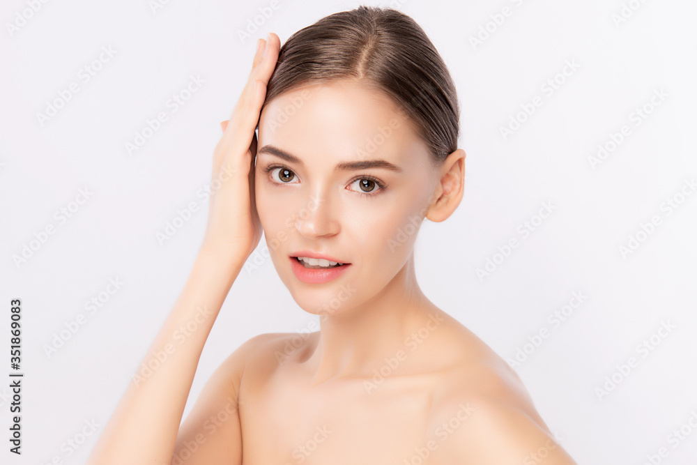 Beautiful Young Woman touching her clean face with fresh Healthy Skin, isolated on white background, Beauty Cosmetics and Facial treatment Concept.