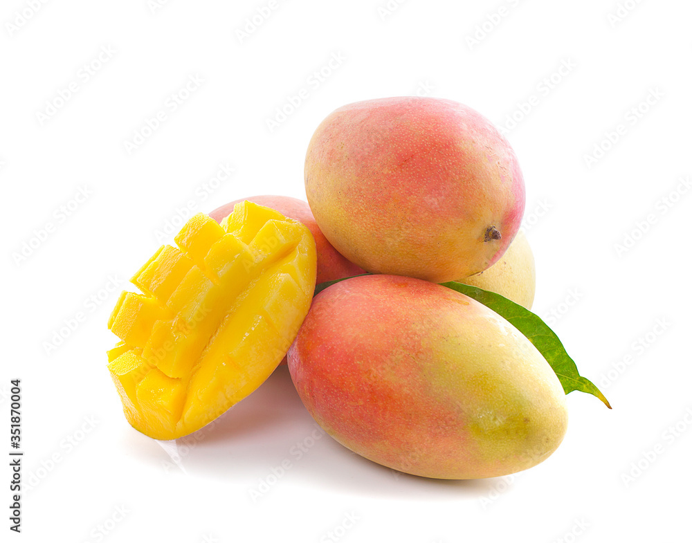 Mango fruit with mango cubes and slices an isolated on a white background Mango fruit with mango cubes and slices an isolated on a white background