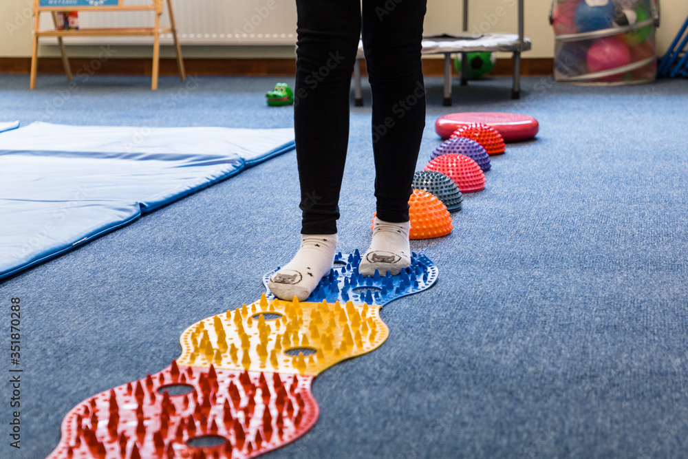 Pediatric Sensory Integration Therapy a child walking on a sensory