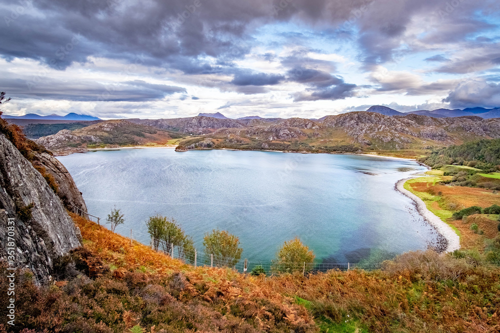 Fototapeta premium Gruinard Bay, Achnasheen in the dramatic highlands of scenic Scotland, fantastic adventure travel destination or holiday vacation to view picturesque scenery at sunrise or sunset