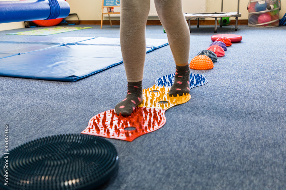 Pediatric Sensory Integration Therapy a child walking on a sensory