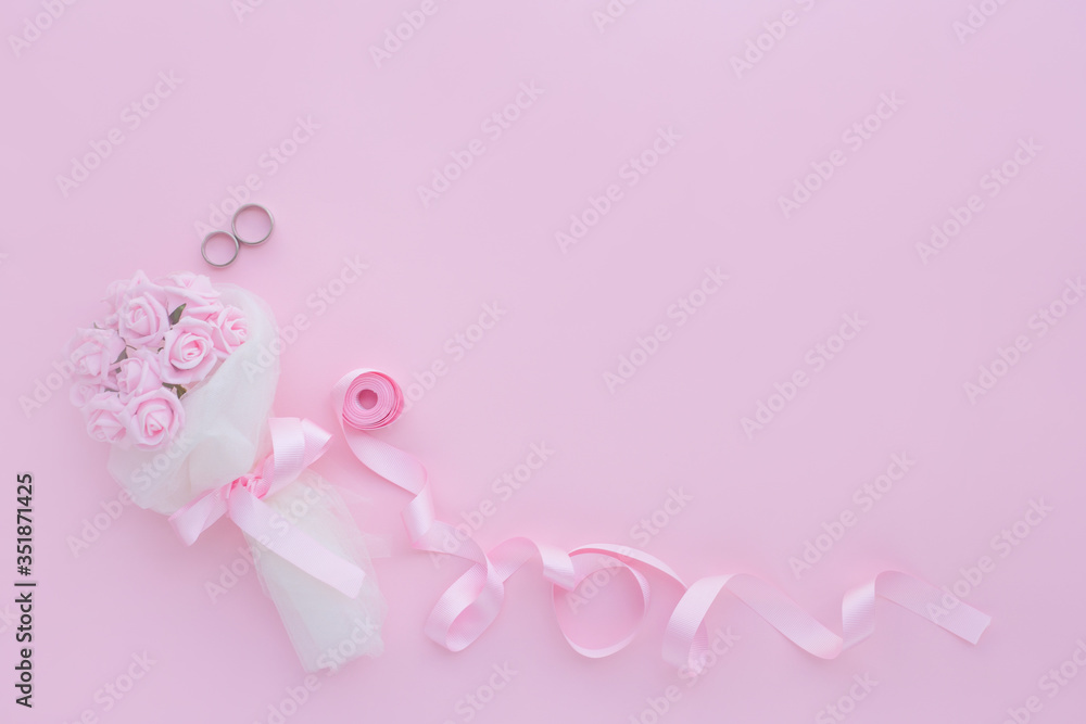 Wedding rings are decorated with a ribbon with copy space. Concept backgrounds for weddings. Wedding rings are decorated with a ribbon with copy space. Concept backgrounds for weddings.