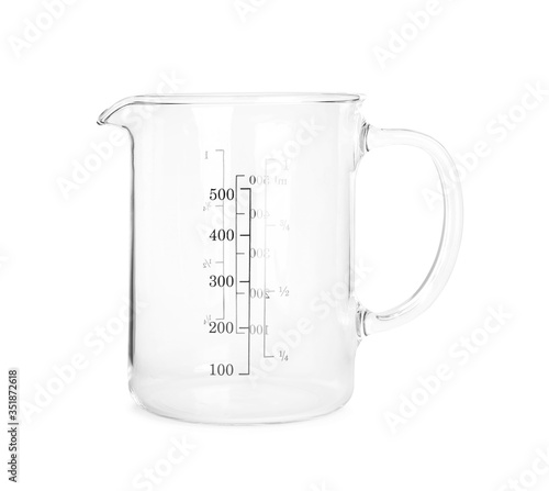 New transparent measuring cup isolated on white. Cooking utensil