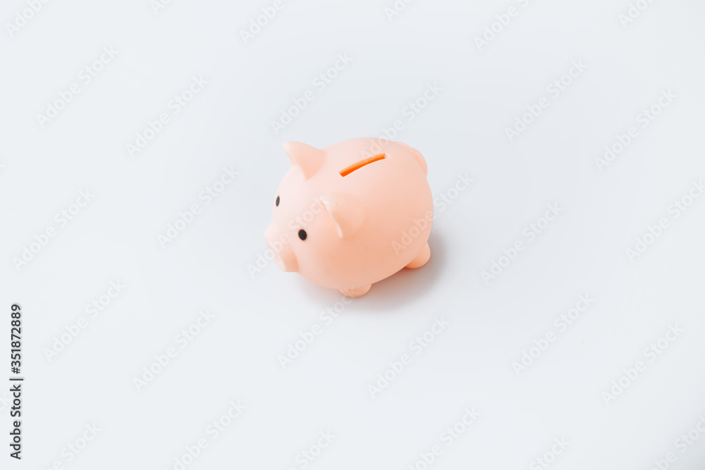 Piggy or coin bank or piggybank or money box - finance and savings concept on white background with shadow.
