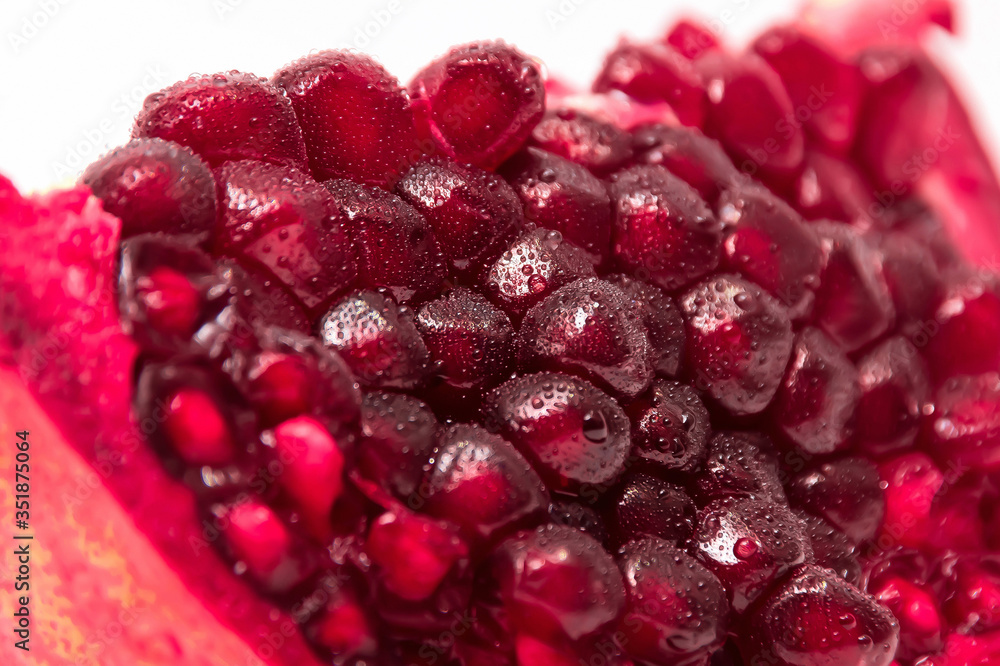a slice of pomegranate on white background a slice of pomegranate on white background