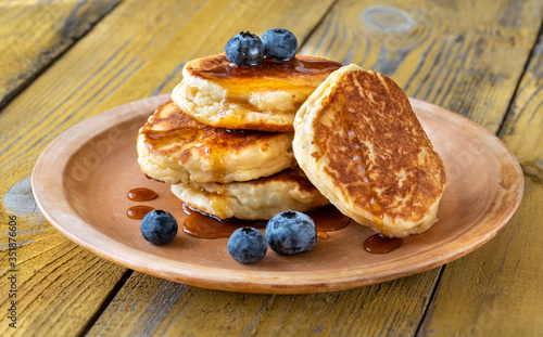 Stack of ricotta pancakes on the plate photo