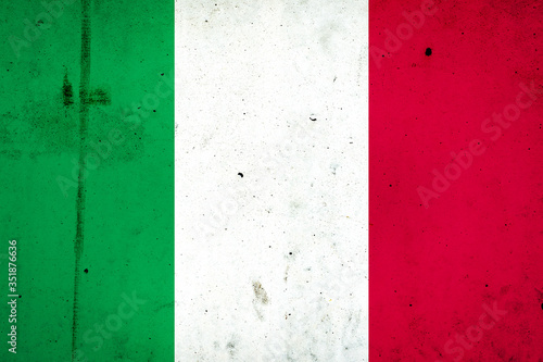 Flag of Italy on a concrete wall. Travels.