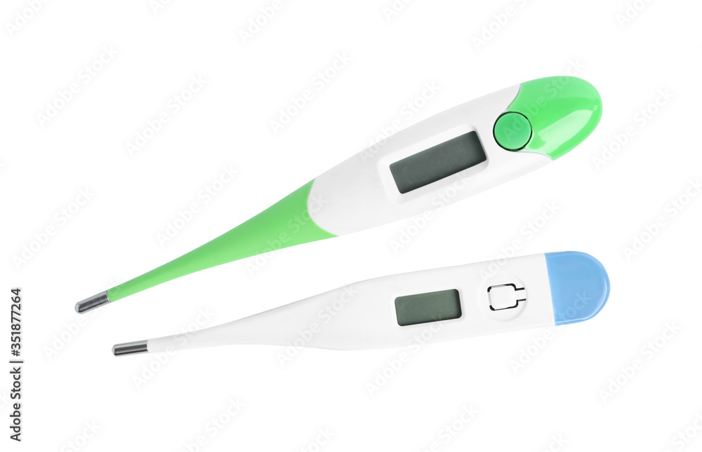 Modern digital thermometers on white background, top view Modern digital thermometers on white background, top view