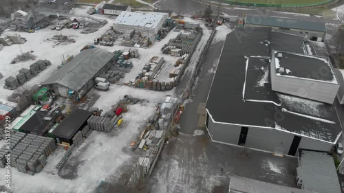 Drone flying over an industrial zone in the suburb of Stockholm, in Alby. Showing the hangars and other buildings. photo