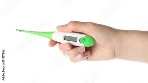 Woman holding digital thermometer on white background, closeup