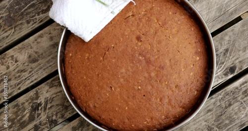 Bringing freshly baked carrot cake into the frame
