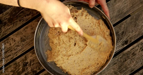 Shaping cake mix with spatula in a pan