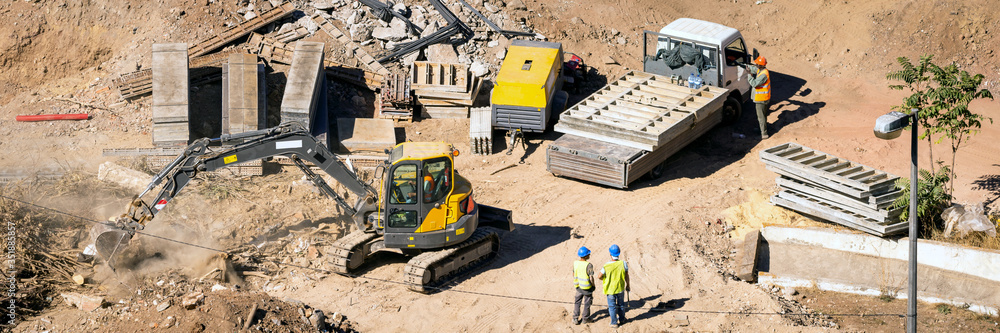 Construction site with special machinery and workers