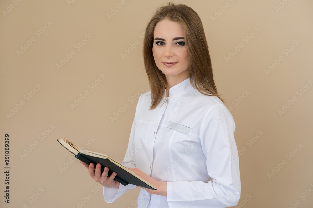 Positive doctor white woman on a beige background Positive doctor white woman on a beige background
