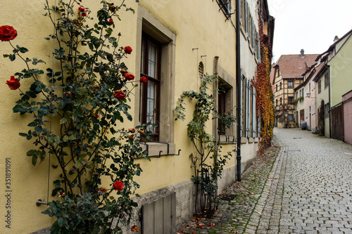 Narrow medieval street in old town Rothenburg ob der Tauber  Bavaria  Germany. November 2014