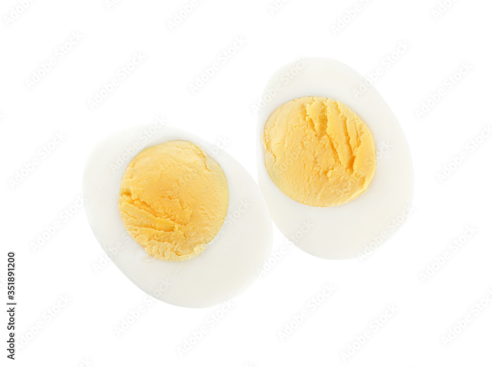 Halves of fresh hard boiled chicken egg isolated on white, top view