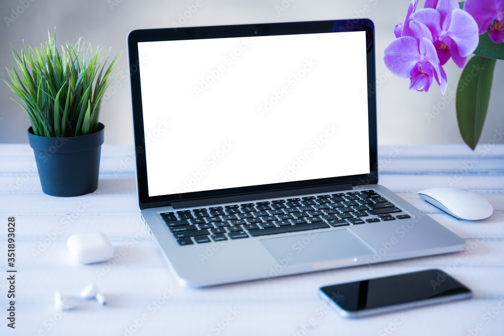 Laptop computer white blank screen on work table front view. Copy space, home and office workspace concept, laptop mockup. Laptop computer white blank screen on work table front view. Copy space, home and office workspace concept, laptop mockup.