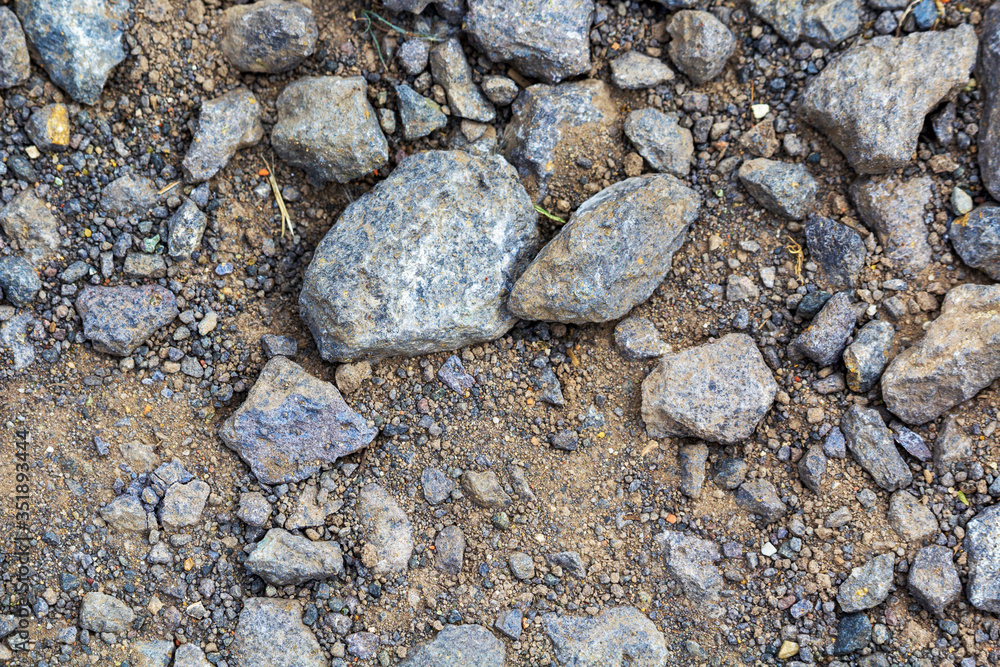 larger lumps of stone, gravel and sand as the foundation of a wind turbine