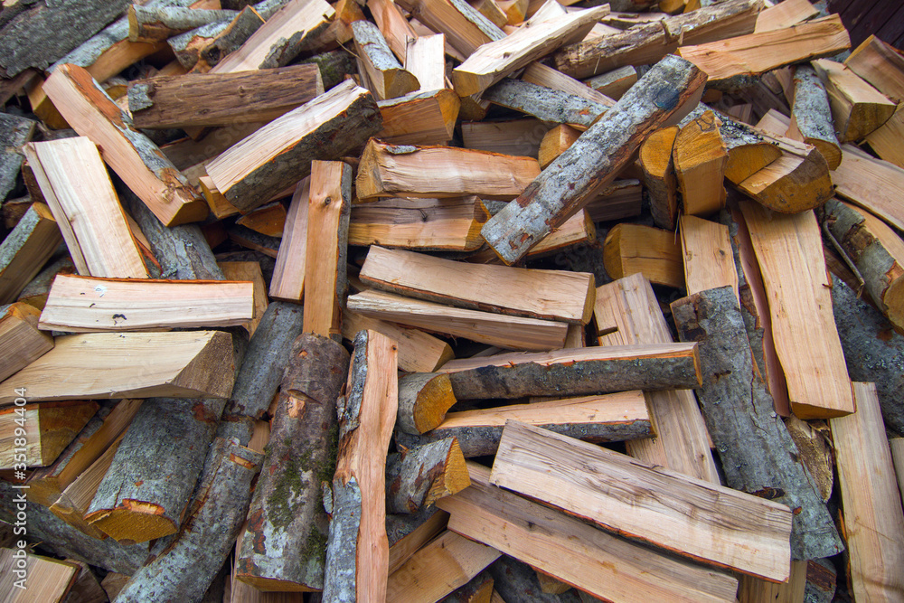 firewood for the fire, background. Dry chopped firewood logs ready for winter firewood for the fire, background. Dry chopped firewood logs ready for winter