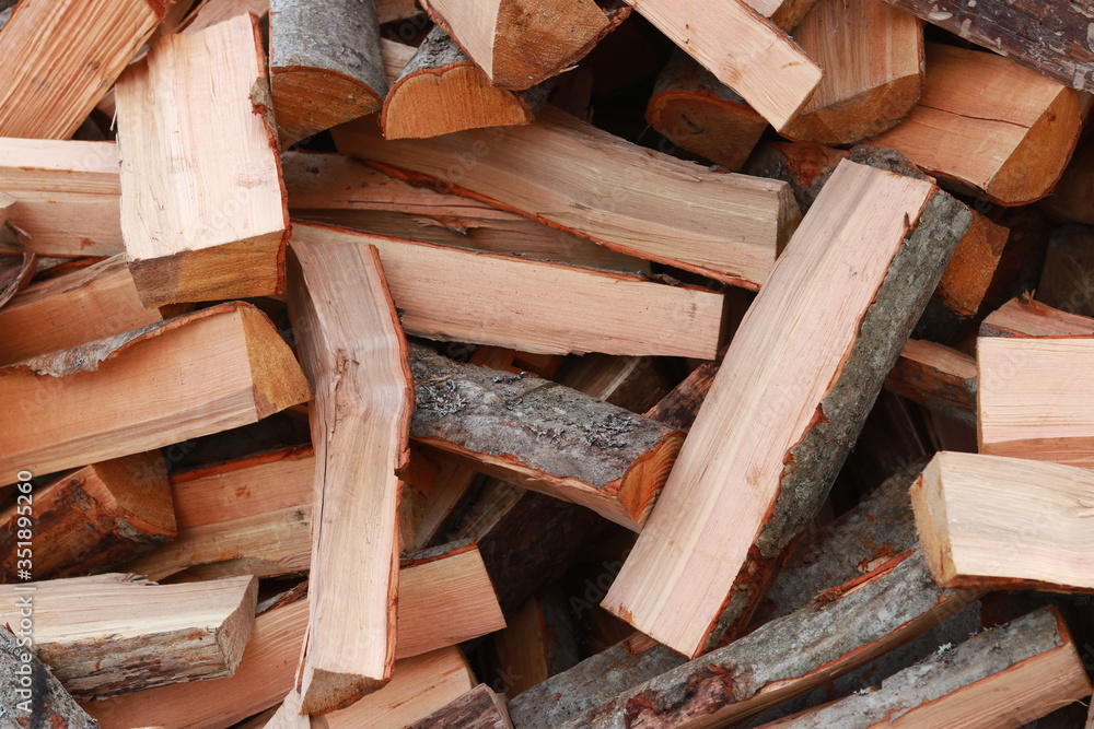 firewood for the fire, background. Dry chopped firewood logs ready for winter firewood for the fire, background. Dry chopped firewood logs ready for winter