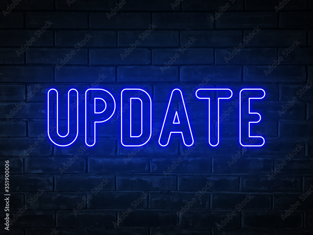 Update - blue neon light word on brick wall background Update - blue neon light word on brick wall background