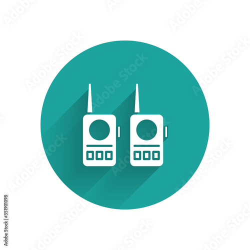 White Walkie talkie icon isolated with long shadow. Portable radio transmitter icon. Radio transceiver sign. Green circle button. Vector