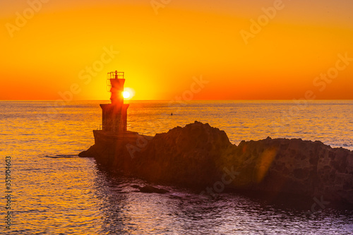 Fishermen at the Lighthouse at the beautiful sunset of the town of Pasajes San Juan. Gipuzkoa, Basque Country