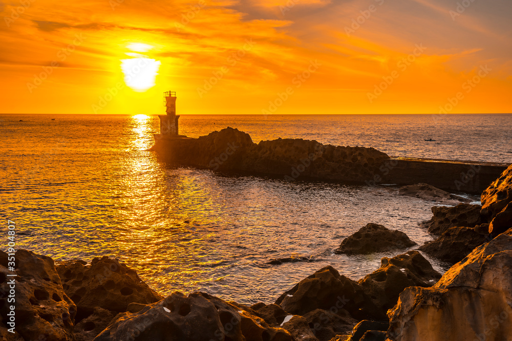 Detail of the lighthouse in the beautiful sunset of the town of Pasajes San Juan. Gipuzkoa, Basque Country
