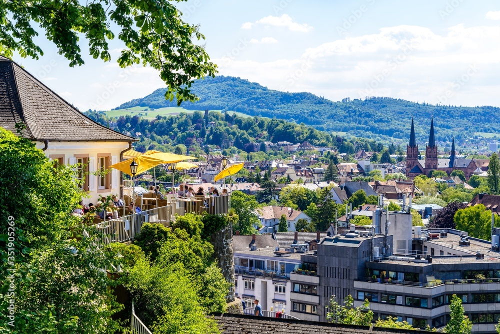 Obraz premium Aerial view on church, city of Freiburg im Breisgau, Beer garden. Baden-wurttemberg, Germany