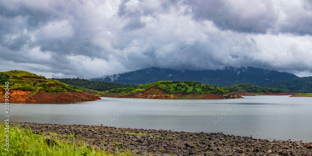 Naklejka premium beautiful landscape lake and hills panorama, Banasura, Kerala, India