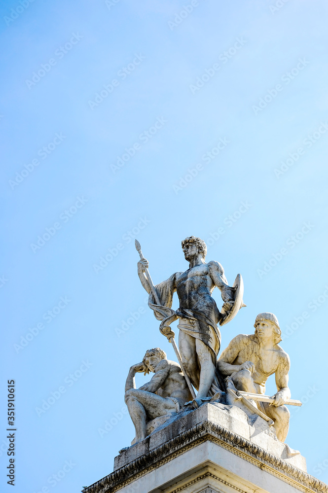 Statues of three armed nude Warriors at the Piazza Venezia in Rome,