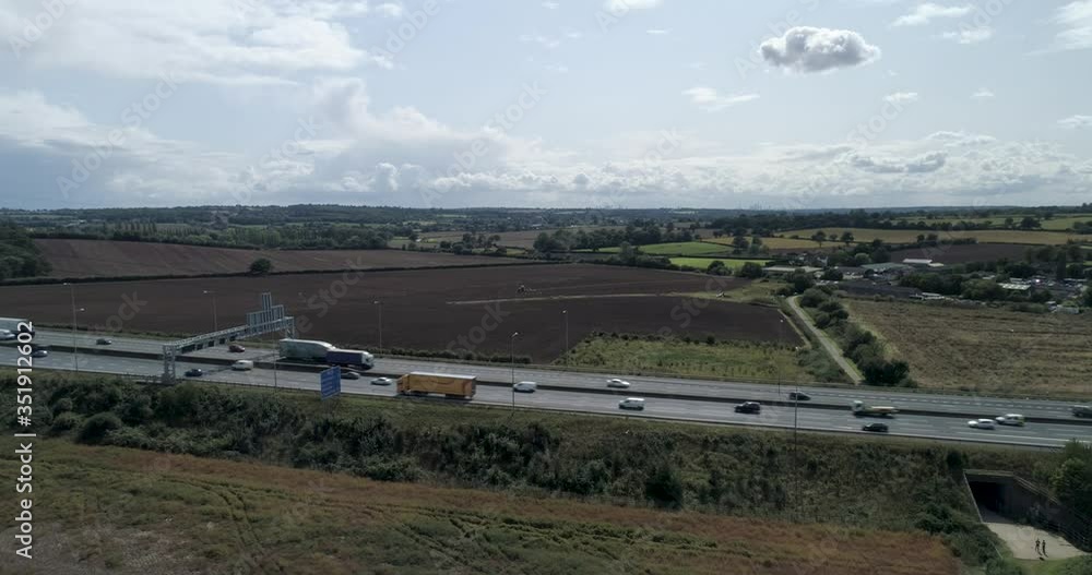 M25 in England built into countryside with surrounding farmland M25 in England built into countryside with surrounding farmland