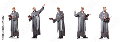 Young priest isolated on the white
