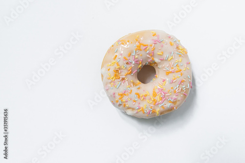 Appetizing sweet donut on a white background. Top view