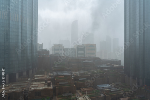 Heavy rain and thunder storm in the city | Abu Dhabi city skyline and downtown | World Trade Center and The Mall photo