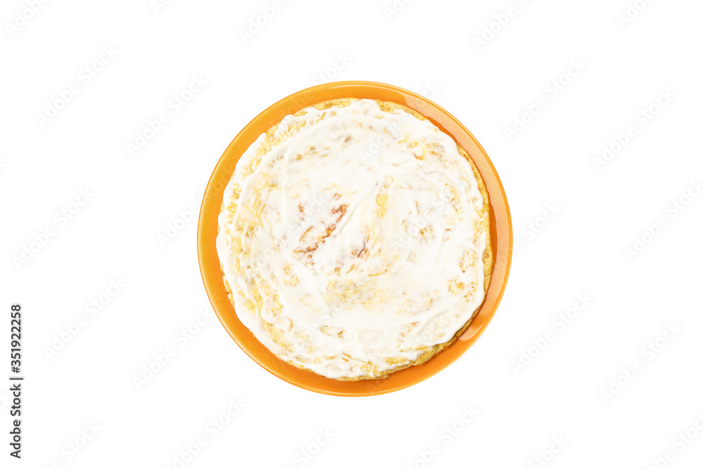 Lubricate the finished oat pancake with yogurt. Flat Lay. Lubricate the finished oat pancake with yogurt. Flat Lay.