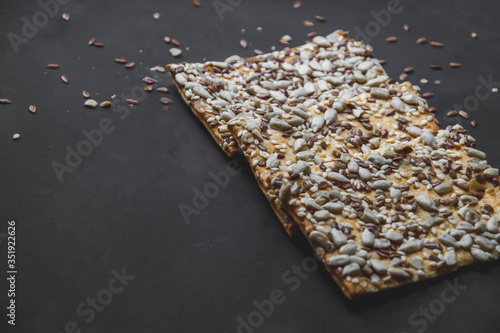 Fotografie Close up picture of cookies with sunflower and chia seeds on the top which locat