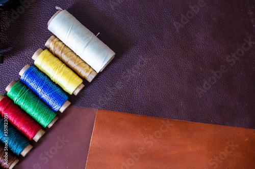 Colorful linin wax thread on leather background craftmanship working