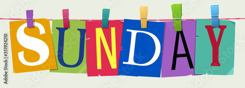 Word "Sunday" attached with hairpins
