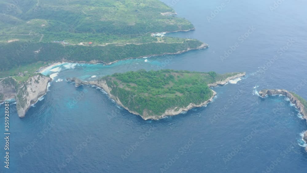 Aerial view of tropical island washed by ocean, Atuh beach. Nusa Penida, Bali Aerial view of tropical island washed by ocean, Atuh beach. Nusa Penida, Bali