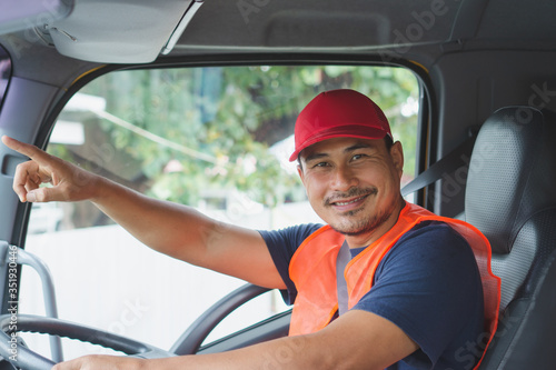The smile of a professional truck driver in a long transportation
