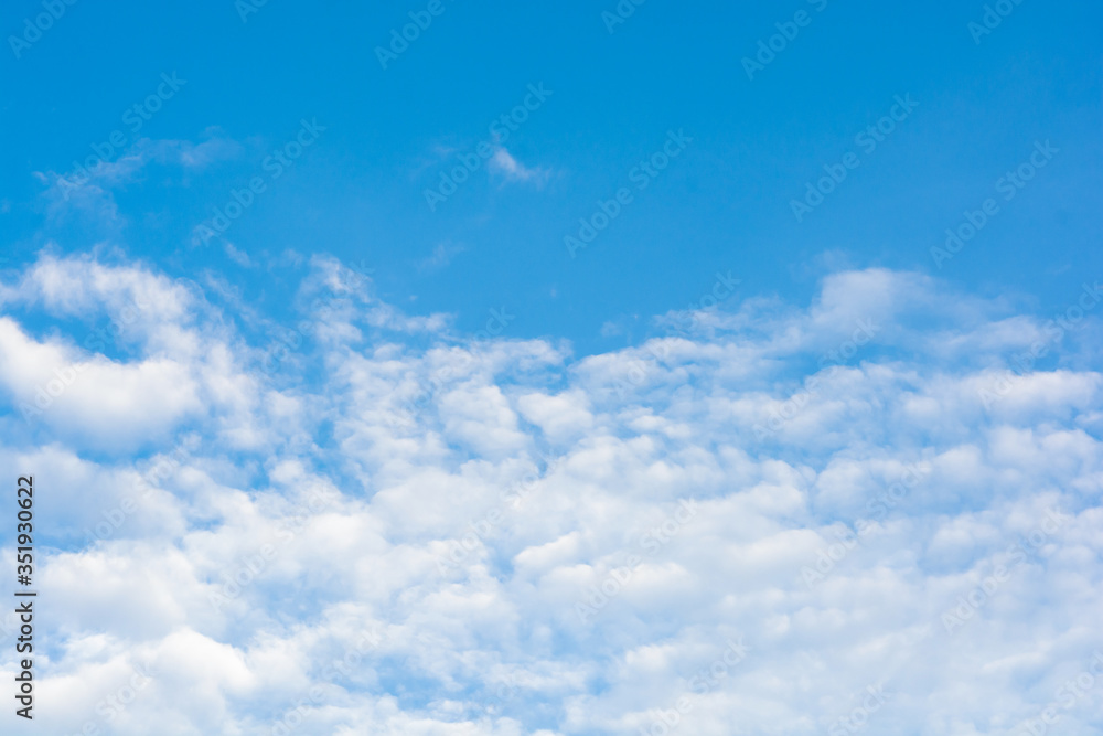 Cirrus clouds on blue sky background..