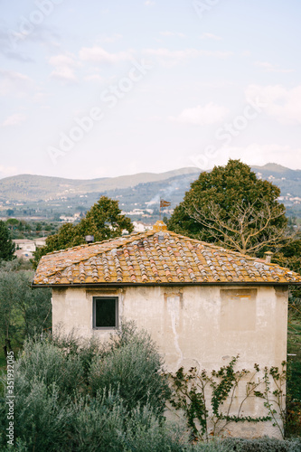 Tiled roof of an old winery villa in Tuscany, Italy.