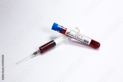 Test tube with blood sample Covid-19 (coronavirus). Laboratory blood test. syringe with blood. 
Covid-19 (coronavirus) positive 
test tube.
