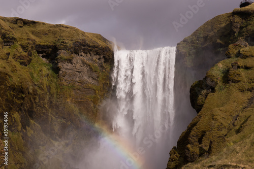 Nature view in Iceland. Famous Skogafoss waterfall with a rainbow 
