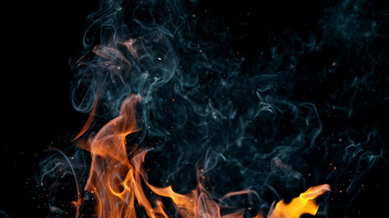 fire flames with sparks on a black background, close-up